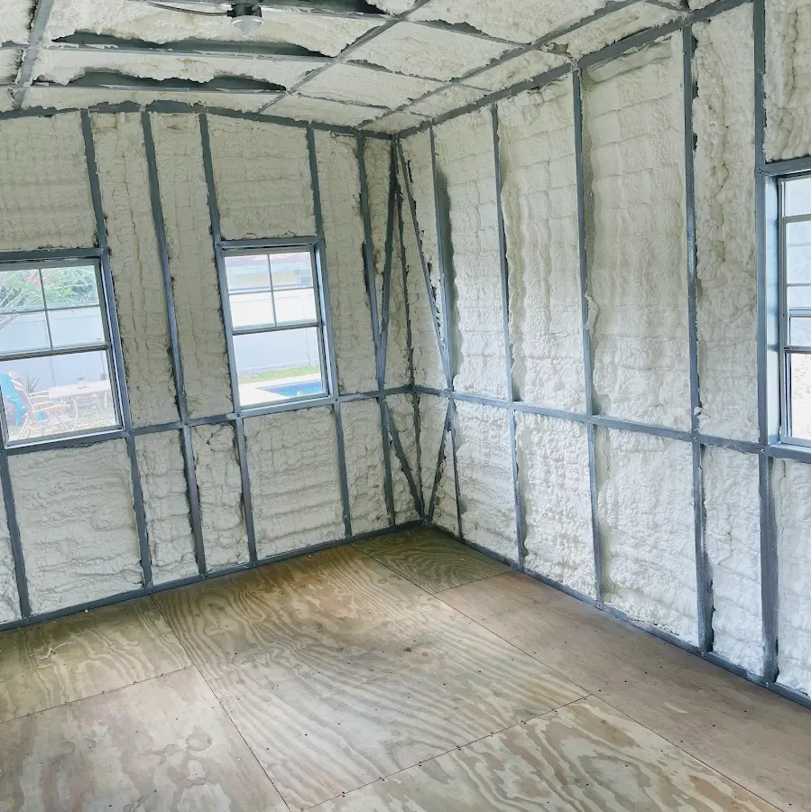 Closed-cell spray foam insulation applied to wall cavities in a residential project in Norwell